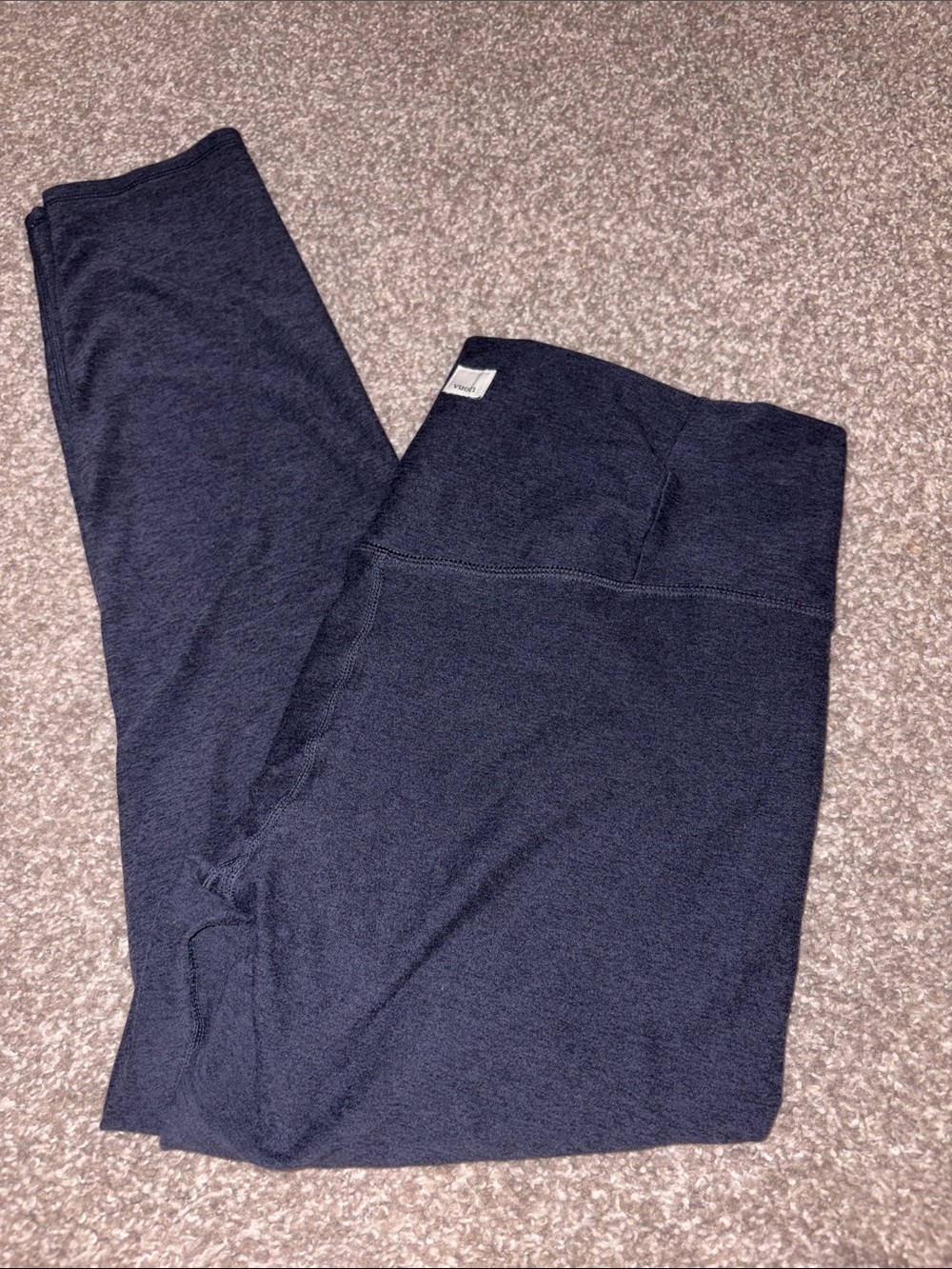Vuori navy heather tee with cream logo patch